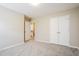 Bedroom features neutral carpet, an exit, and a closet at 107 Kimeo Way, Garner, NC 27529
