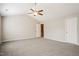Spacious bedroom with a ceiling fan and two doors at 107 Kimeo Way, Garner, NC 27529