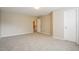 Neutral bedroom with carpet, a door to the hallway, and a closet at 107 Kimeo Way, Garner, NC 27529