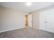 This bedroom features carpet and a double door closet at 107 Kimeo Way, Garner, NC 27529