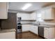 Efficient kitchen with stainless steel appliances and gray granite countertops at 107 Kimeo Way, Garner, NC 27529