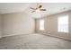 Spacious main bedroom with vaulted ceiling, neutral carpet, and sunlit windows at 107 Kimeo Way, Garner, NC 27529