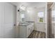 Bathroom with double sinks, granite countertops, and tiled shower at 110 Gallery Park Dr, Franklinton, NC 27525