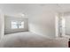 Bright bedroom with plush carpet and natural light at 110 Gallery Park Dr, Franklinton, NC 27525