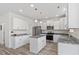 Well-lit kitchen featuring white cabinets, granite countertops, stainless steel appliances, and an island at 110 Gallery Park Dr, Franklinton, NC 27525