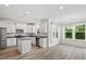 Modern kitchen with white cabinets, granite countertops, stainless steel appliances, and an island at 110 Gallery Park Dr, Franklinton, NC 27525