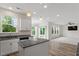 Bright kitchen with an island, granite countertops, and views of the backyard at 110 Gallery Park Dr, Franklinton, NC 27525