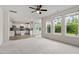 Open-concept living space with hardwood floors, a modern kitchen, and lots of natural light at 110 Gallery Park Dr, Franklinton, NC 27525