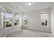 Spacious living room with large windows, carpet, and neutral wall color, offering plenty of light at 110 Gallery Park Dr, Franklinton, NC 27525