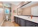 Bathroom with a large vanity, toilet, and decorative mirror at 113 Fetzer Ct, Cary, NC 27513
