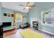 Bedroom with sloped ceilings, ceiling fan, and a yellow rug at 113 Fetzer Ct, Cary, NC 27513