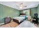 Bedroom with hardwood floors, ceiling fan, and desk at 113 Fetzer Ct, Cary, NC 27513
