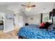 Primary bedroom features a vaulted ceiling, hardwood floors, and large windows at 113 Fetzer Ct, Cary, NC 27513