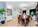 Inviting dining room with hardwood floors, a decorative chandelier, and a built-in display cabinet at 113 Fetzer Ct, Cary, NC 27513