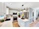 Bright kitchen with white cabinetry, stainless steel appliances, and butcher block countertops with a kitchen island at 113 Fetzer Ct, Cary, NC 27513