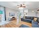 Cozy living room featuring hardwood floors, modern furniture, and exterior access at 113 Fetzer Ct, Cary, NC 27513