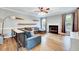 Spacious living room with hardwood floors, a fireplace, and abundant natural light at 113 Fetzer Ct, Cary, NC 27513