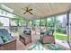 Bright sunroom featuring comfortable seating, skylights, and backyard views with play set at 113 Fetzer Ct, Cary, NC 27513