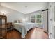 Bedroom featuring wood-look flooring, natural light and a neutral color palette at 117 Rack Ct, Willow Springs, NC 27592
