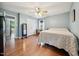 Bedroom showcasing wood-look flooring, large mirror and natural lighting at 117 Rack Ct, Willow Springs, NC 27592