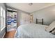 Bedroom featuring wood-look floors, closet with organizers, and neutral paint at 117 Rack Ct, Willow Springs, NC 27592