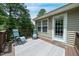 Deck with outdoor seating and access to the home featuring an outdoor rug with geometric pattern at 117 Rack Ct, Willow Springs, NC 27592