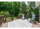 Deck with outdoor seating featuring an outdoor rug with geometric pattern and wooden railing at 117 Rack Ct, Willow Springs, NC 27592