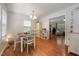 Sunny dining room features hardwood floors, natural light, and cozy seating, creating a pleasant dining experience at 117 Rack Ct, Willow Springs, NC 27592