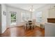 Sunny dining room features hardwood floors, natural light, and cozy seating, creating a pleasant dining experience at 117 Rack Ct, Willow Springs, NC 27592