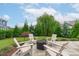 Landscaped backyard with fire pit and seating area, perfect for outdoor gatherings at 120 Hazel Alder Ct, Holly Springs, NC 27540