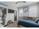 A cozy bedroom features a themed decor, carpet, a window, and a comfortable bed with blue bedding at 120 Hazel Alder Ct, Holly Springs, NC 27540