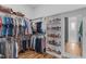 Organized walk-in closet with ample storage for clothing, shoes, and accessories at 120 Hazel Alder Ct, Holly Springs, NC 27540