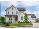 Charming two-story home with a well-maintained lawn, lush shrubbery, and a welcoming front porch at 120 Hazel Alder Ct, Holly Springs, NC 27540