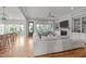Spacious living room with hardwood floors, fireplace, and comfortable seating with natural light at 120 Hazel Alder Ct, Holly Springs, NC 27540