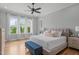 Serene main bedroom with plenty of natural light and a comfortable king-sized bed at 120 Hazel Alder Ct, Holly Springs, NC 27540