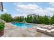 Backyard with refreshing pool, spa, and lounge chairs ideal for outdoor enjoyment at 120 Hazel Alder Ct, Holly Springs, NC 27540