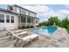 Resort-style pool and patio area with lounge chairs for sunbathing and relaxation at 120 Hazel Alder Ct, Holly Springs, NC 27540