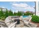 Beautiful backyard with pool, hot tub, fire pit and outdoor seating area at 120 Hazel Alder Ct, Holly Springs, NC 27540