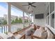 Relaxing screened porch with comfortable seating and view of backyard pool at 120 Hazel Alder Ct, Holly Springs, NC 27540
