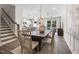 Bright dining area featuring an open floor plan, modern decor, and seamless flow to the living room at 1213 Everton Ave, Durham, NC 27703