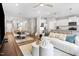 Open-concept living area featuring a dining area, a kitchen island, comfortable seating, and modern decor at 1213 Everton Ave, Durham, NC 27703