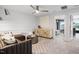 Relaxing living room featuring modern furniture, neutral colors, and a view into an adjacent bedroom at 1213 Everton Ave, Durham, NC 27703