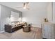 Stylish living room with a comfortable leather sofa, accent lighting, and a decorative cabinet at 1213 Everton Ave, Durham, NC 27703