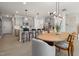 An open-concept dining and kitchen area with modern decor and stylish lighting at 1215 Everton Ave, Durham, NC 27703