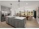 A gourmet kitchen with an island that features a stainless steel dishwasher at 1215 Everton Ave, Durham, NC 27703