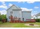 Fenced backyard featuring a wood deck and a home with blue siding at 1217 Heritage Greens Dr, Wake Forest, NC 27587