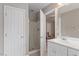 Neutral toned bathroom with white cabinets, a walk-in shower, and modern fixtures at 1217 Heritage Greens Dr, Wake Forest, NC 27587