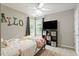 Bright bedroom with a ceiling fan and colorful bedding, perfect for children at 1217 Heritage Greens Dr, Wake Forest, NC 27587