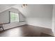 Bonus room featuring hardwood floors, a window, and track lighting at 1217 Heritage Greens Dr, Wake Forest, NC 27587