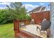 Inviting outdoor deck with stylish furniture, offering a cozy space for relaxation and enjoyment of the surroundings at 1217 Heritage Greens Dr, Wake Forest, NC 27587